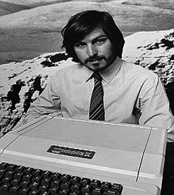 FILE - This 1977 file photo shows Apple Computer Inc. founder Steve Jobs as he introduces the new Apple II computer in Cupertino, Calif. Apple Inc. on Wednesday, Aug. 24, 2011 said Jobs is resigning as CEO, effective immediately. He will be replaced by Tim Cook, who was the company's chief operating officer. It said Jobs has been elected as Apple's chairman.  (AP Photo/Apple Computers Inc., file)